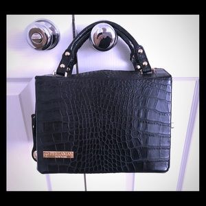 Black leather PERSAMAN handbag w/ gold zipper.
